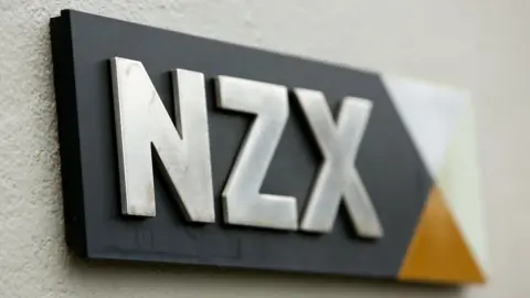 Getty Images The NZX stock exchange logo is seen on a plaque on a wall in this file photo