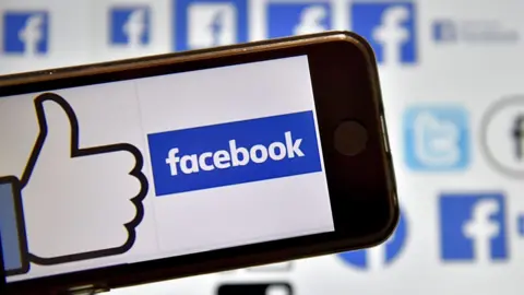 AFP The Facebook logo displayed on a smartphone screen.