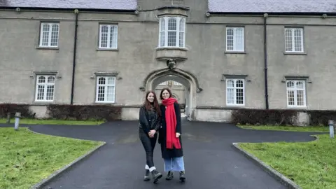 University of Wales Trinity St David Valeriia Pivensay (left) and Anastasiia Patiuk (right) outside the Lampeter campus