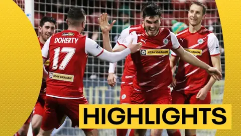 Luke Turner celebrates scoring for Cliftonville