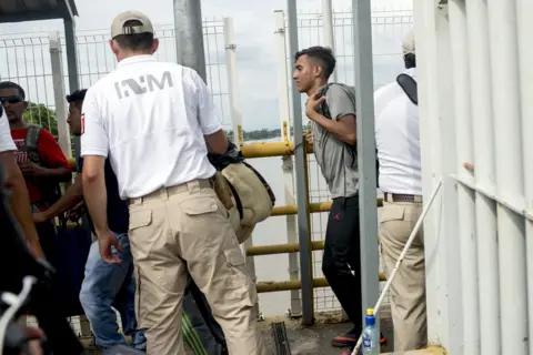 Encarni Pindado A migrant enters Mexico at the border with Guatemala.