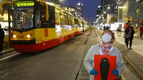 EPA A protester in Warsaw