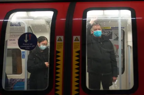 PA Media Two passengers on central line