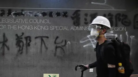 AFP A sign outside the council building is covered in graffiti