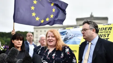 Getty Images Alliance Party leader Naomi Long speaks to the media following her meeting with Prime Minister Boris Johnson at Stormont on July 31, 2019 in Belfast, Northern Ireland. The Prime Minister is on his first official visit to Northern Ireland to discuss Brexit, and the restoration of the Northern Ireland Assembly, with the main political parties.