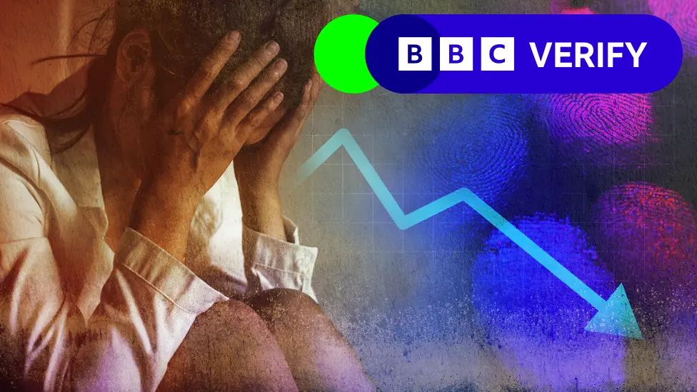 BBC Woman holding head in hands