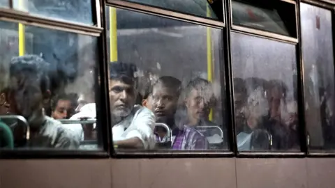 Migrants on a bus