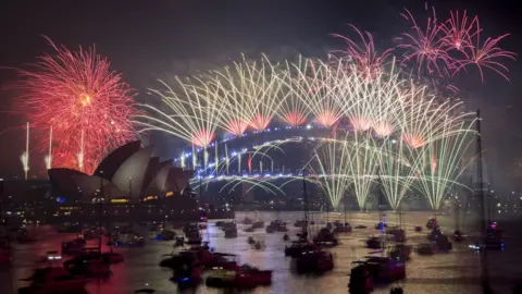 EPA Fireworks explode over the harbour and the Sydney Harbour Bridge landmark during New Year's celebrations in Sydney, Australia, 1 January 2019