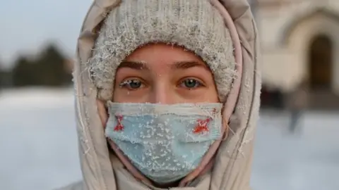 Reuters A woman attends a rally in support of jailed Russian opposition leader Alexei Navalny in Omsk,