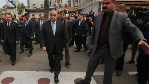 AFP Iraqi Prime Minister Adel Abdul Mahdi arrives at a funeral ceremony in Baghdad (23 October 2019)