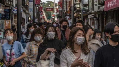 Getty Images Crowds in street in Japan