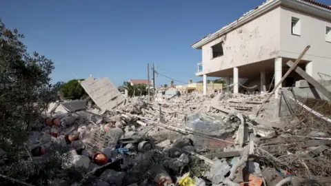 EPA Image shows destroyed remains of a house, thought to be a bomb-making centre for the group.