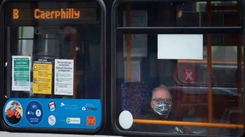 Getty Images A bus in Caerphilly with a passenger wearing a mask