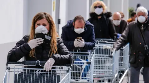 Getty Images File pic of a queue of Italians in Palermo