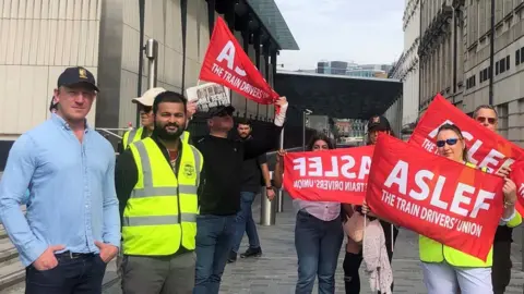 PA Media Sam Tarry with striking Aslef workers at Paddington Station in London