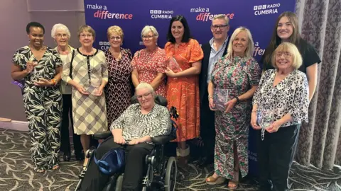 Group photograph of the winners of BBC Radio Cumbria's Make a Difference Awards 2023