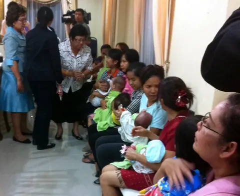 EPA Thai nannies holding nine suspected surrogate babies after a police raid at a residential apartment