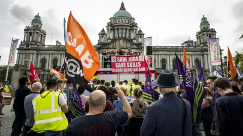 PA Media Harland and Wolff workers and trade unionists protest outside Belfast City Hall