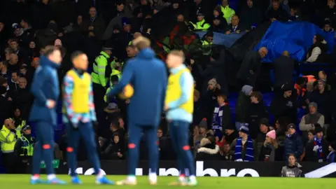Getty Images Medics attend to a supporter during half-time