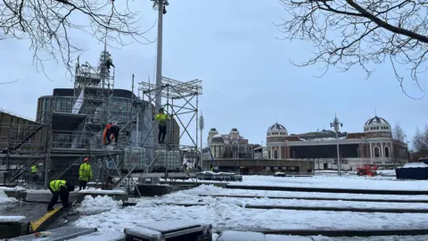 Workers setting up stage in Bradford city centre