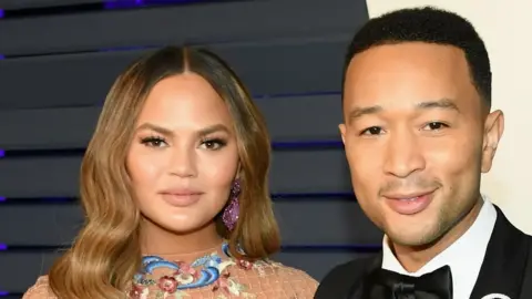 Getty Images Chrissy Teigen and John Legend in 2019