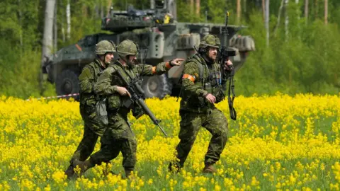 Reuters Canadian soldiers of the NATO Enhanced Forward Presence battlegroup run during a military drill