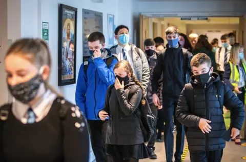 PA Media Students at St Columba"s High School, Gourock, wear protective face masks as they head to lessons as the requirement for secondary school pupils to wear face coverings when moving around school comes into effect across Scotland