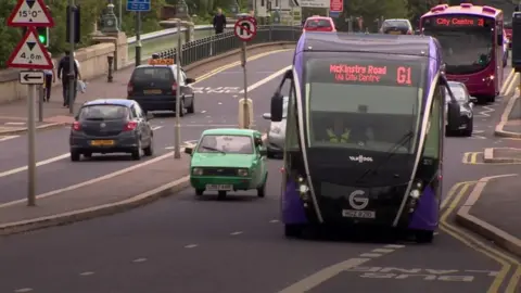 A G1 Glider passes over the Albert Bridge headed for west Belfast