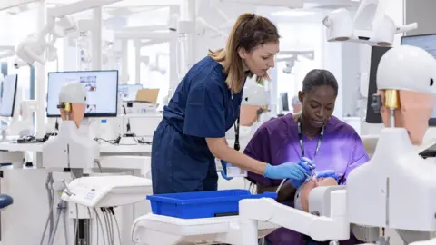 University of Bristol A student and a clinician working together