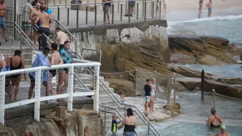 Getty Images Swimmers and beachgoers at Bronte Beach in Sydney on Tuesday