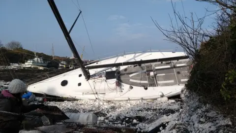 Jonathan Fox A destroyed boat at the marina