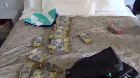 AFP Cash and cocaine seized by police