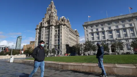 PA Media Man in face mask in Liverpool