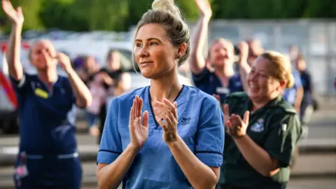 Getty Images NHS staff clapping