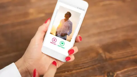 Someone looking at a dating app on a smartphone