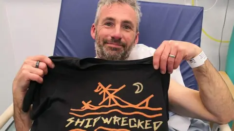 Penlee RNLI man in hospital bed