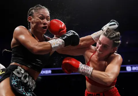 ANDREW COULDRIDGE / Reuters Alycia Baumgardner in action against Mikaela Mayer, WBO World Super Featherweight Title fight at the O2 Arena, London, Britain, 15 October 2022