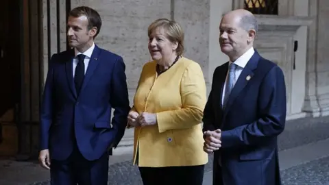 Getty Images Macron, Merkel and Scholz