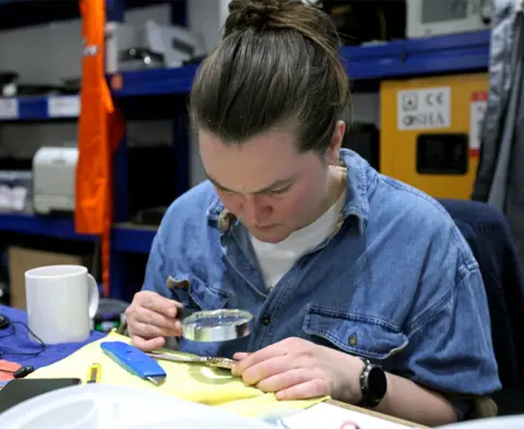 BBC Petra repairs a smartwatch at the Fixing Factory in Camden, London