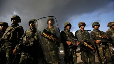 Reuters Thai soldiers stand guard during a coup at the Army Club where Thailand"s army chief held a meeting with all rival factions in central Bangkok May 22, 2014.