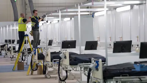 Getty Images Fitting bed bays inside NHS Nightingale