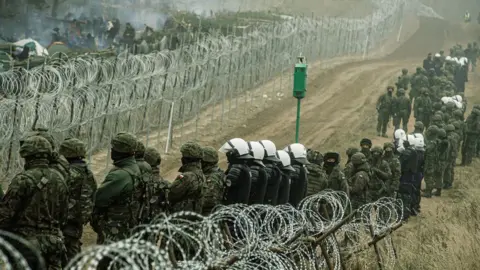 Getty Images Kuznica border area with Polish border guard