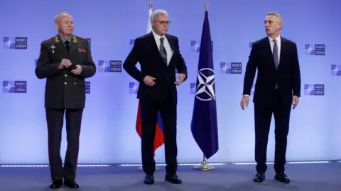 Reuters/Pool Russian Deputy Defence Minister Colonel General Alexander Fomin, Russian Deputy Foreign Minister Alexander Grushko and NATO Secretary General Jens Stoltenberg are seen during Nato-Russia Council at the Alliance headquarters in Brussels, Belgium January 12, 2022