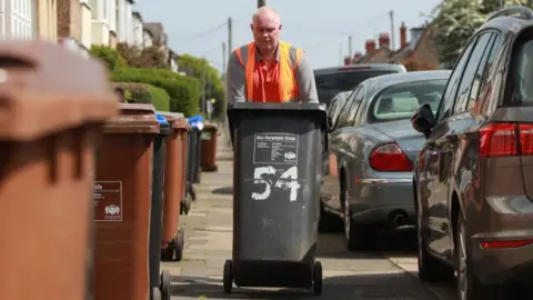 Getty Images Bin collector.