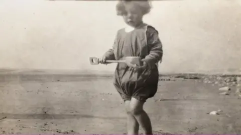 Family photo Joyce Currie aged 2, in 1927, on Fairbourne beach