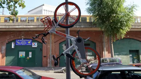 Reuters A Mobike hanging from a lamp-post in Berlin