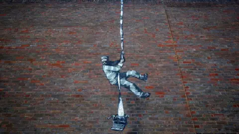 PA Media Banksy artwork on Reading Prison