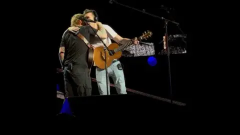 Klara Luke Gittins hugging Ed Sheeran