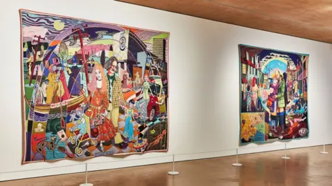 Joseph Horton Two vivid and large tapestries side by side on an art gallery wall