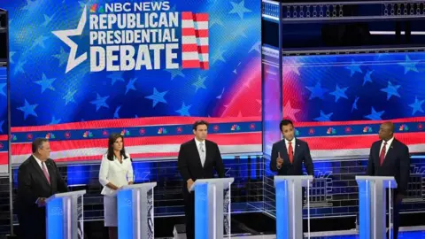 Getty Images Image shows the candidates on stage in Miami